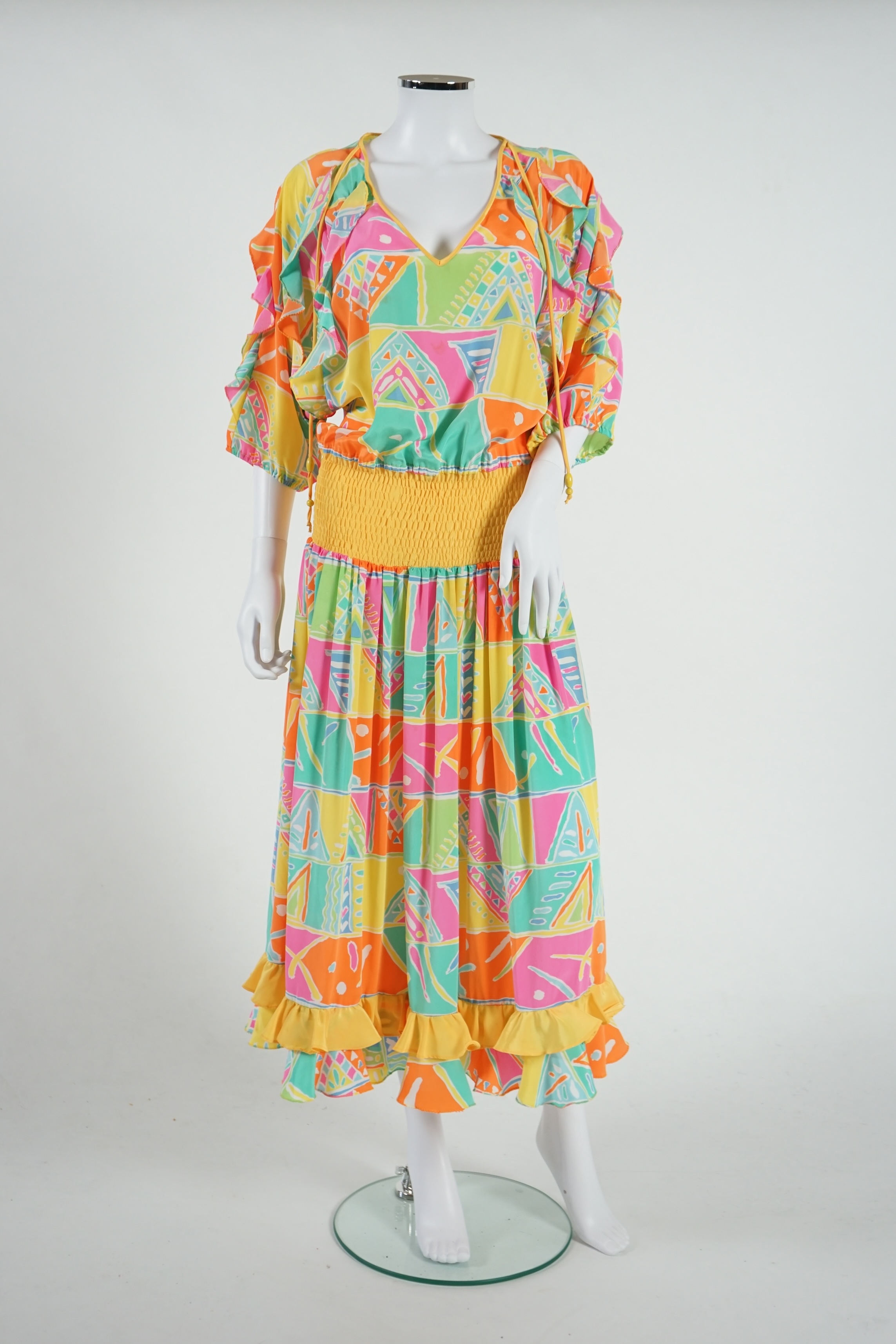 Three multi coloured dresses, no labels. Approx size 10-12 Proceeds to Happy Paws Puppy Rescue